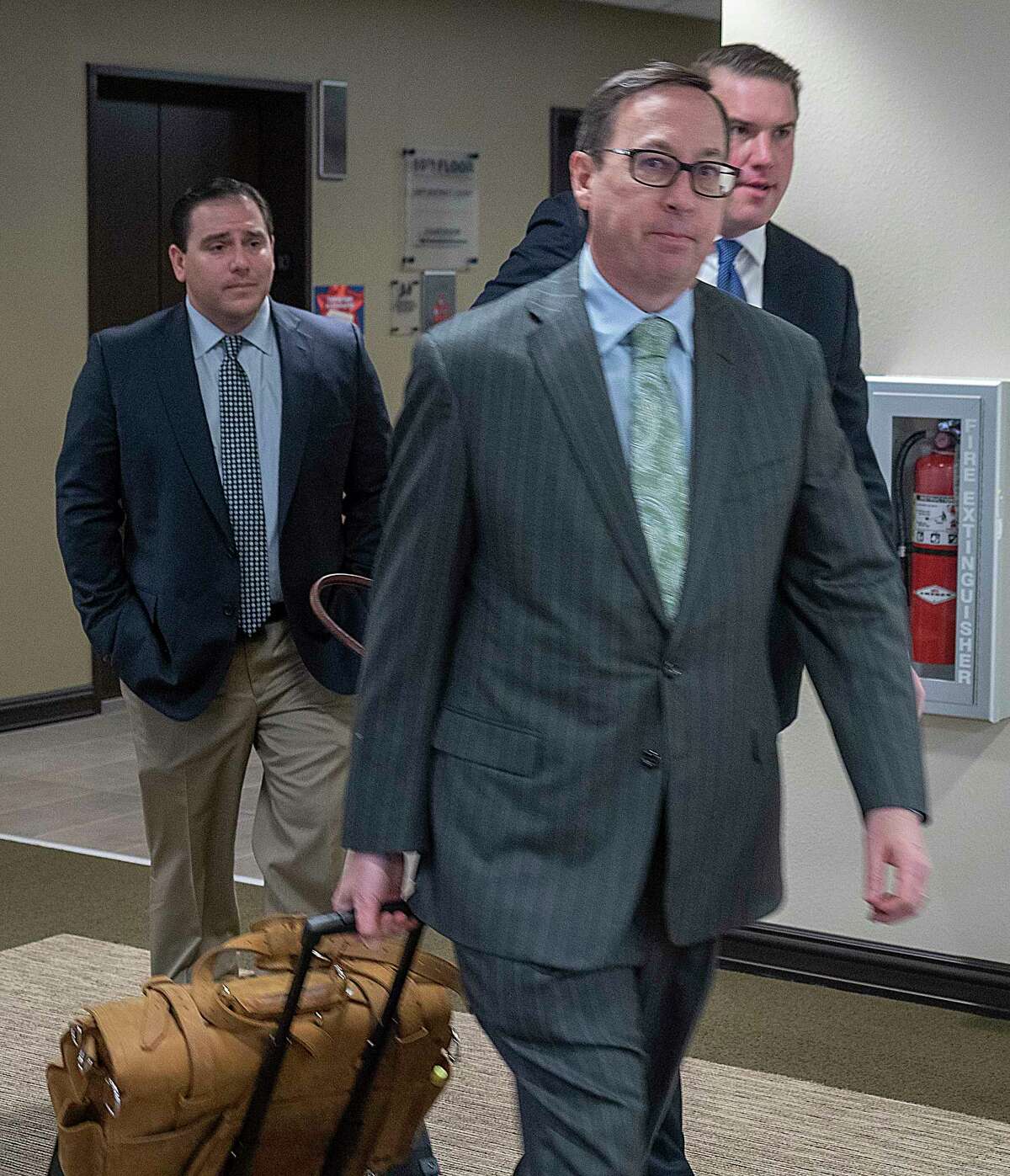 Midland defense attorney, Brian Carney, leads his team, as well as defendant David Wilson, into court 11/02/2021 for jury selection at Midland County Courthouse for the murder trial of Officer Nathan Herdelberg. Tim Fischer/Reporter-Telegram