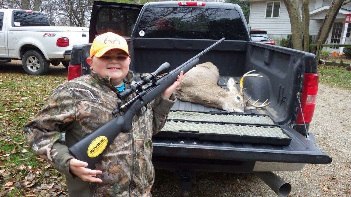 Logan Ruiz of Fairgrove, age 9, received an early Christmas gift last year, a Mossberg "youth" rifle in the new .350 Legend round, and used it on the second day of the 2020 regular firearms deer season to bag this eight-point buck with one shot at 87 yards. A week later, he would drop a  large doe with one shot at 202 yards. He is presently counting the days until opening day 2021. (Tom Lounsbury/Hearst Michigan)