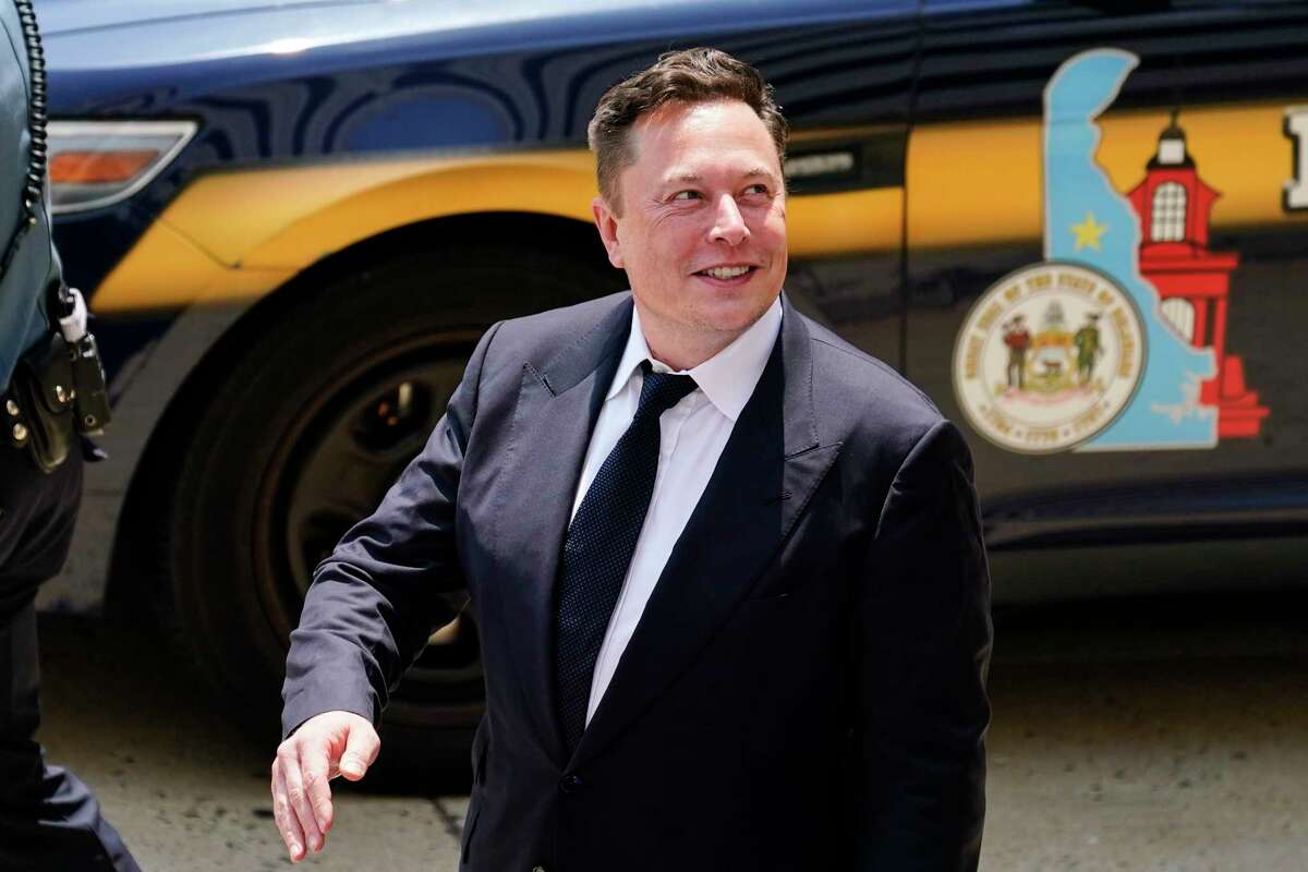 FILE - CEO Elon Musk departs from the justice center in Wilmington, Del., Tuesday, July 13, 2021. 