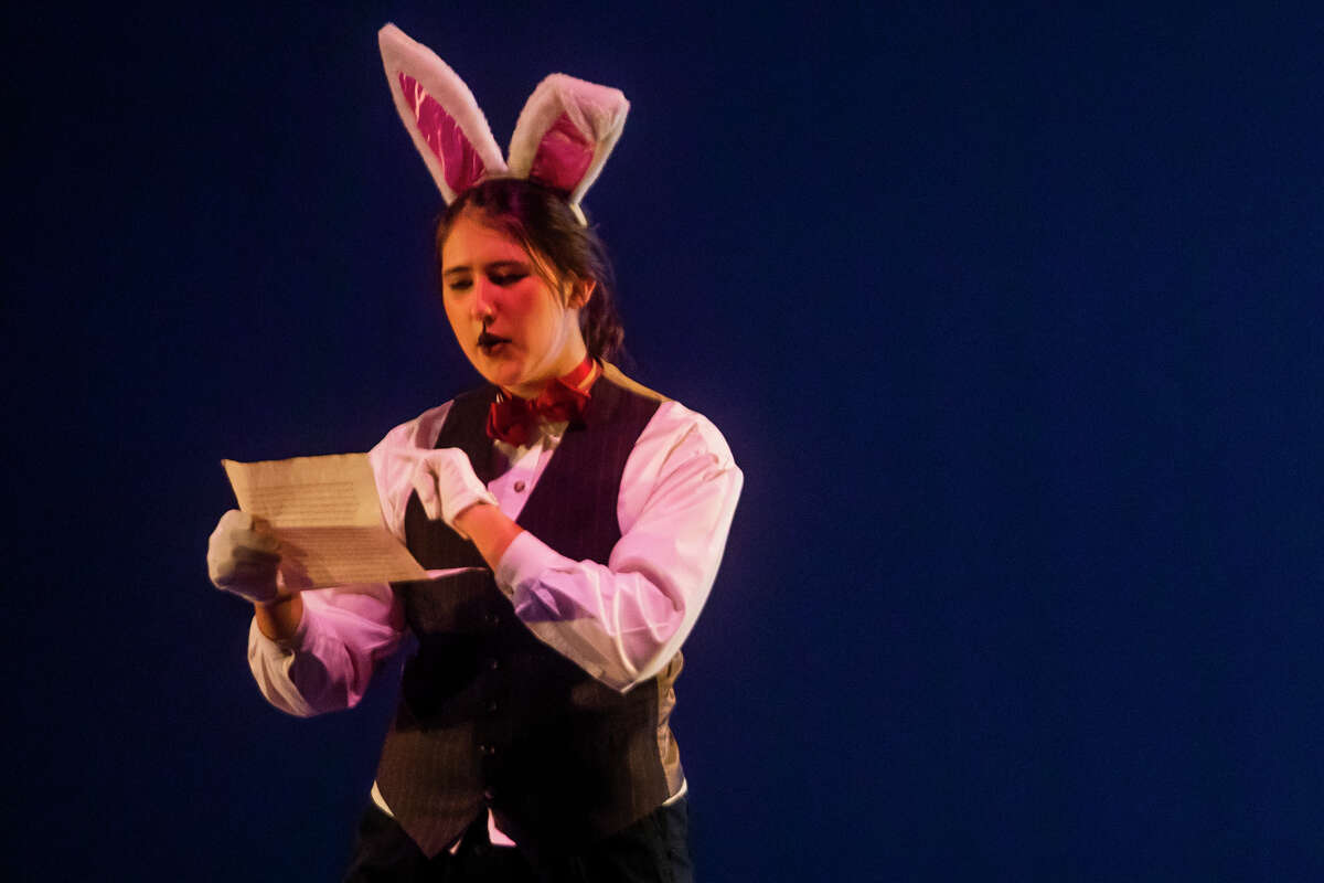 Ryleigh Monville in the role of the White Rabbit rehearses a scene during a dress rehearsal for Bullock Creek High School's production of "Alice in Wonderland" Monday, Nov. 1, 2021 at the school's auditorium. (Katy Kildee/kkildee@mdn.net)