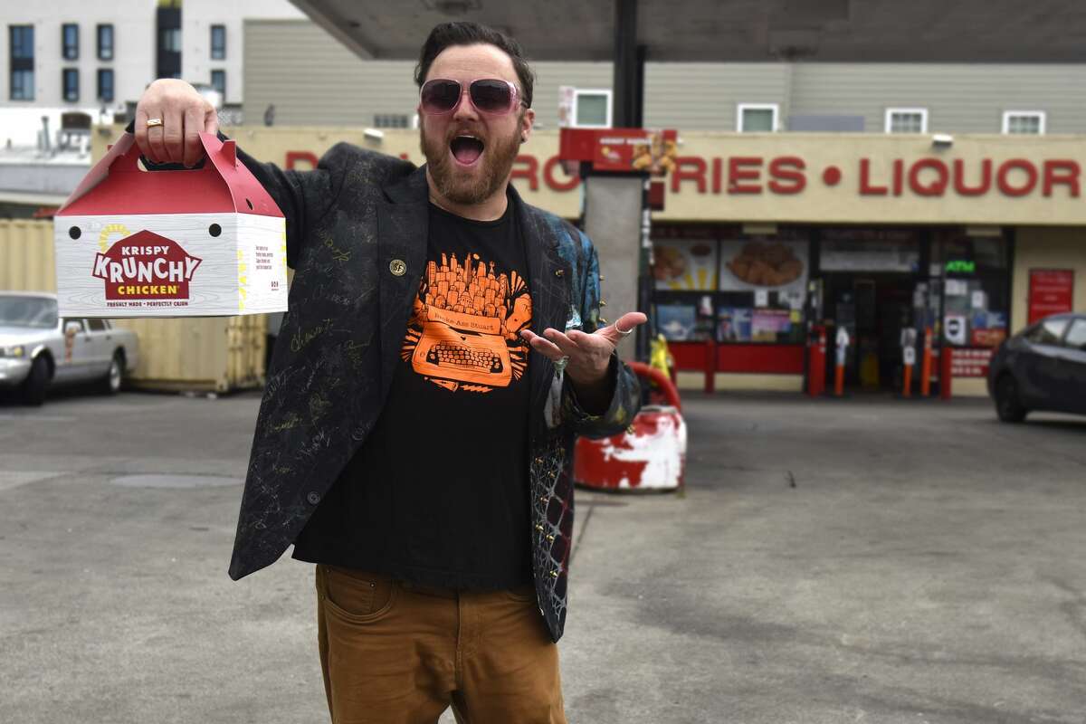 Stuart Schuffman, AKA Broke-Ace Stuart leaves the Gas and Shop on South Van Ness Avenue in San Francisco with a box of Krispy Krunchy Chicken on Tuesday, November 2, 2021.