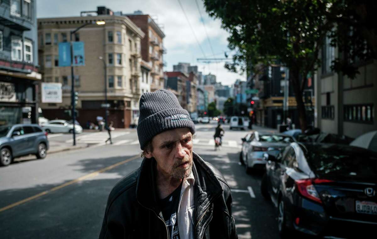 Jeff Reaves, a homeless man, walks to his tent in the Tenderloin area of San Francisco.