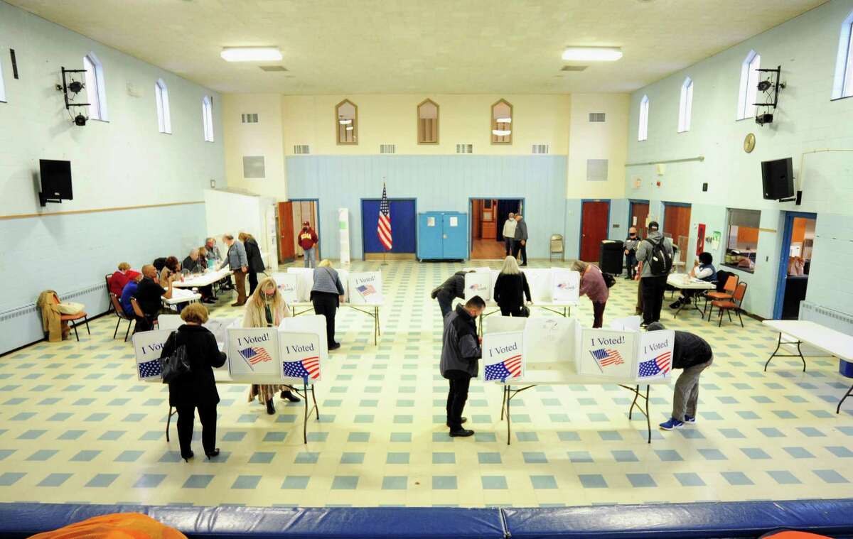A view of voters filling out ballots at the polling station at Recreation Star Center in Stamford on Tuesday.