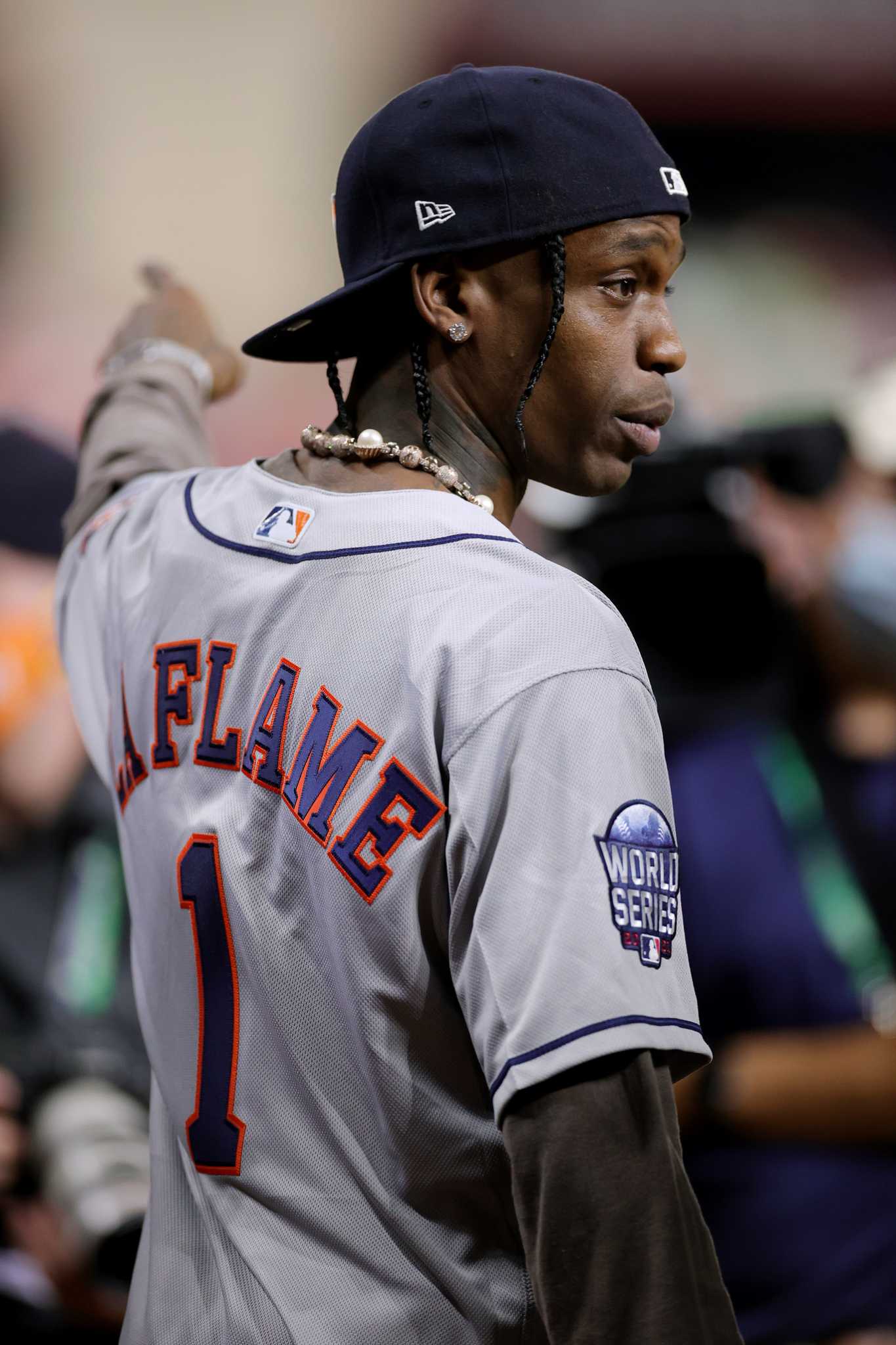 Houston rapper Travis Scott, right, and Houston Astros pitcher Lance  McCullers Jr hug in the dugout before a baseball game between the Chicago  Cubs and Houston Astros Monday, May 15, 2023, in