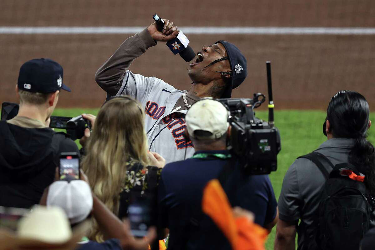 HOUSTON, TEXAS - NOVEMBER 02: Rapper Travis Scott announces "play ball" prior to Game Six of the World Series between the Houston Astros and the Atlanta Braves at Minute Maid Park on November 02, 2021 in Houston, Texas.