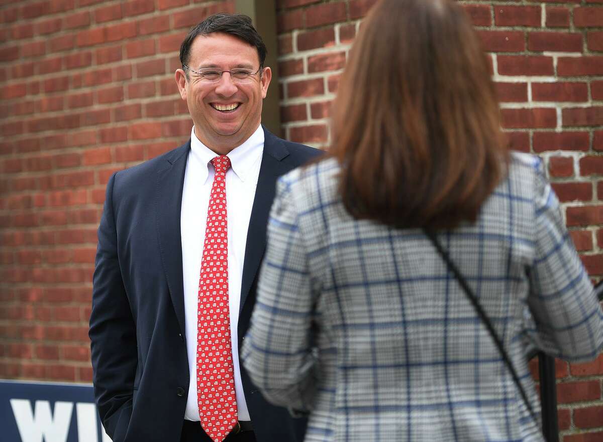 Milford Mayor Ben Blake talks with a voter outside the polls at the Margaret Egan Center in Milford, Conn. on Tuesday, November 2, 2021.
