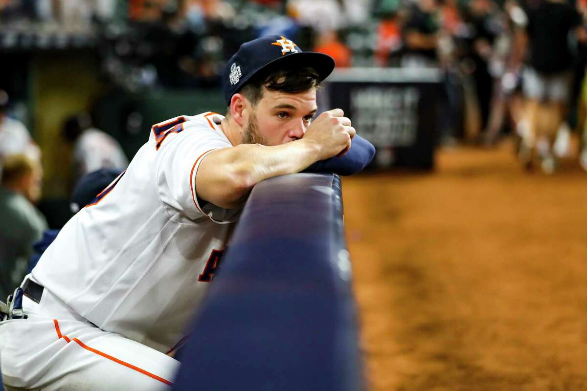 Houston Astros center fielder Chas McCormick (20) watches from the dugout as the Atlanta Braves celebrate their World Series title with a 7-0 win of Game 6 of the World Series on Tuesday, Nov. 2, 2021 at Minute Maid Park in Houston.