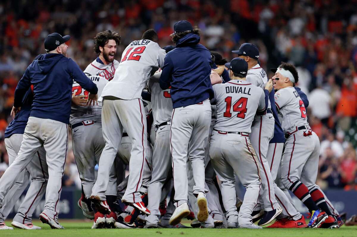 HOUSTON, TEXAS - NOVEMBER 02: The Atlanta Braves celebrate their 7-0 win against the Houston Astros in Game Six to win the 2021 World Series at Minute Maid Park on November 02, 2021 in Houston, Texas. (Photo by Elsa/Getty Images)