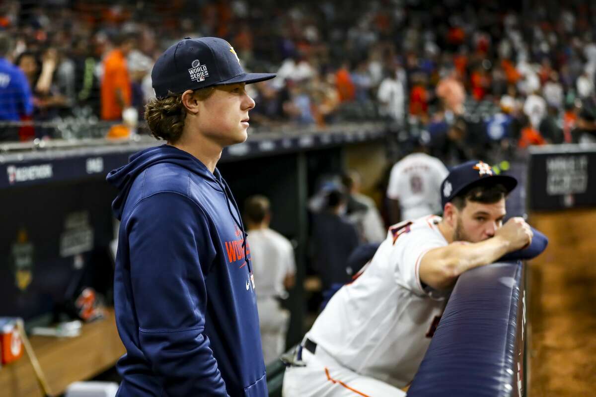 Houston Astros center fielder Jake Meyers signs an autograph after