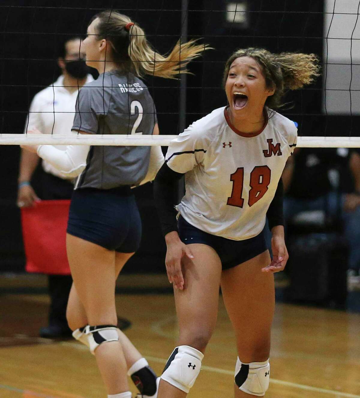 Madison's Dallasstar Johnson (18) reacts after a winning point against Smithson Valley during the first round of Class 6A volleyball playoffs on Tuesday, Nov. 2, 2021.