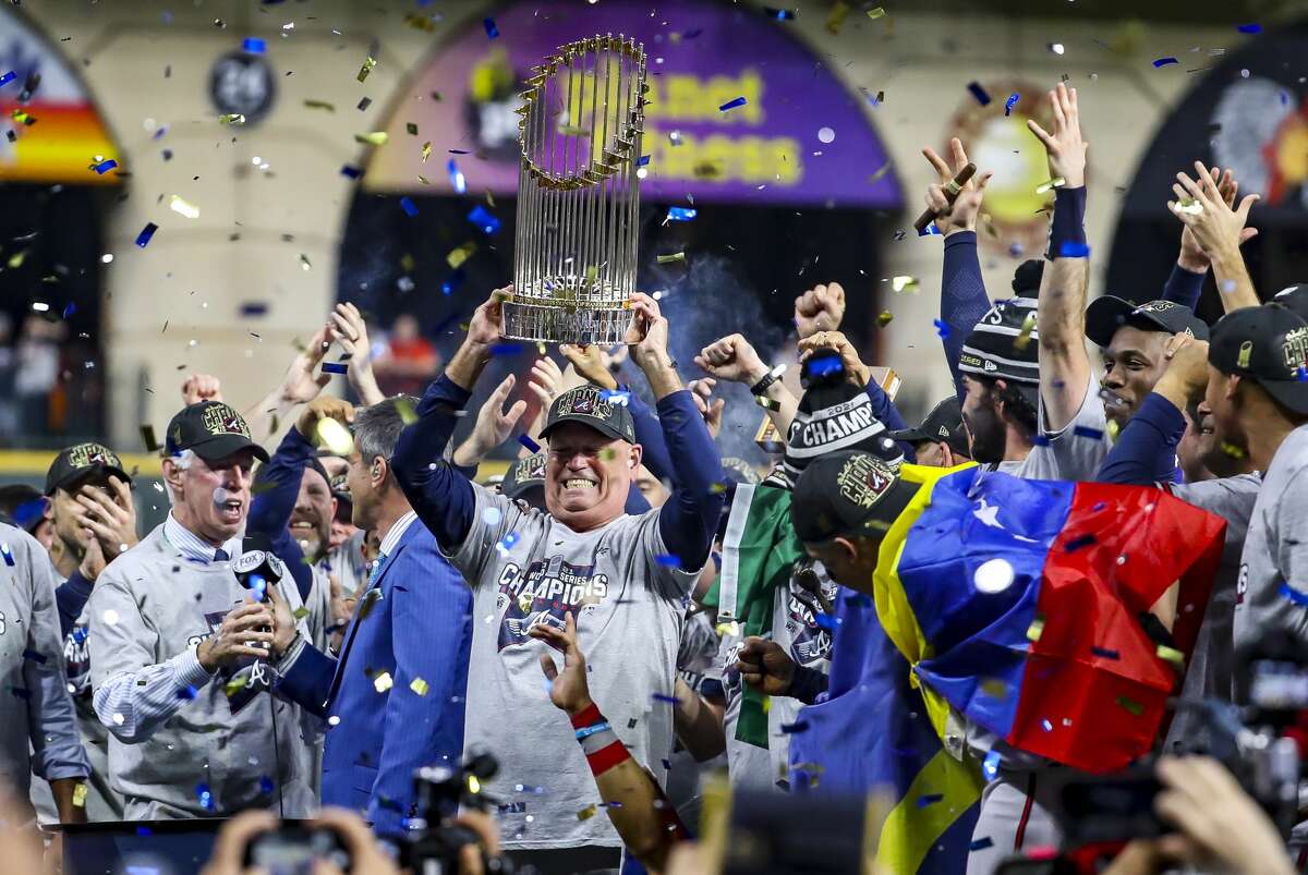 Atlanta Braves manager Brian Snitker (43) holds up the World Series trophy after Game 6 of the World Series on Tuesday, Nov. 2, 2021 at Minute Maid Park in Houston.