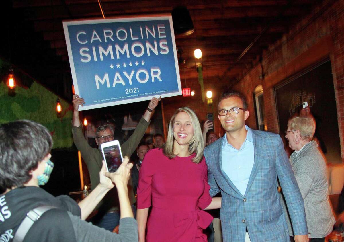 Mayoral candidate Caroline Simmons arrives with her husband Art at Third Place by Half Full Brewery to celebrate her win on election night in Stamford on Tuesday.