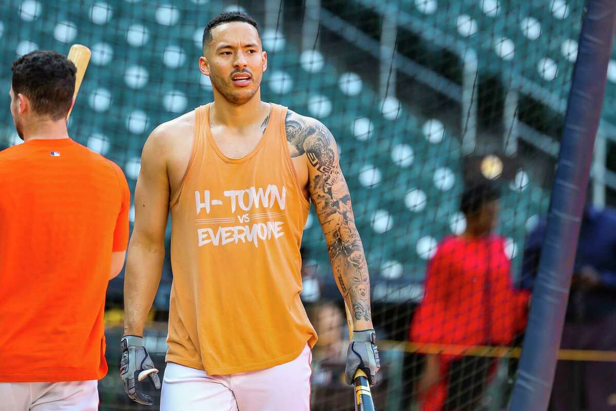 Houston Astros shortstop Carlos Correa (1) takes batting practice wearing an "H-Town vs Everyone" tank top before Game 6 of the World Series on Tuesday, Nov. 2, 2021 at Minute Maid Park in Houston.