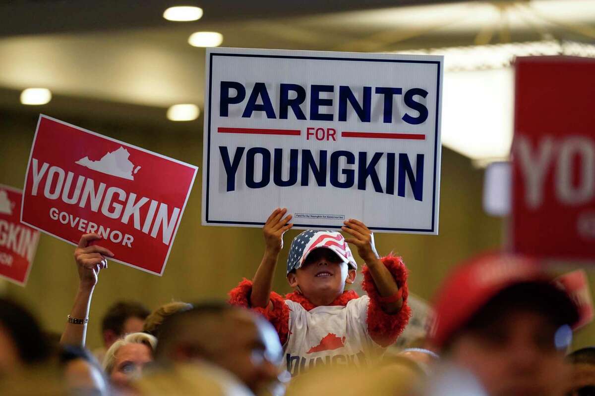 Supporters of Republican gubernatorial candidate Glenn Youngkin gather for an election night party in Chantilly, Va., on Tuesday, Nov. 2, 2021.