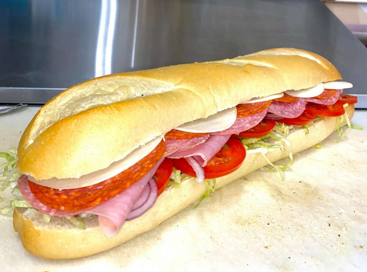 An Italian sandwich, which includes ham, salami, pepperoni from Deli and Brew