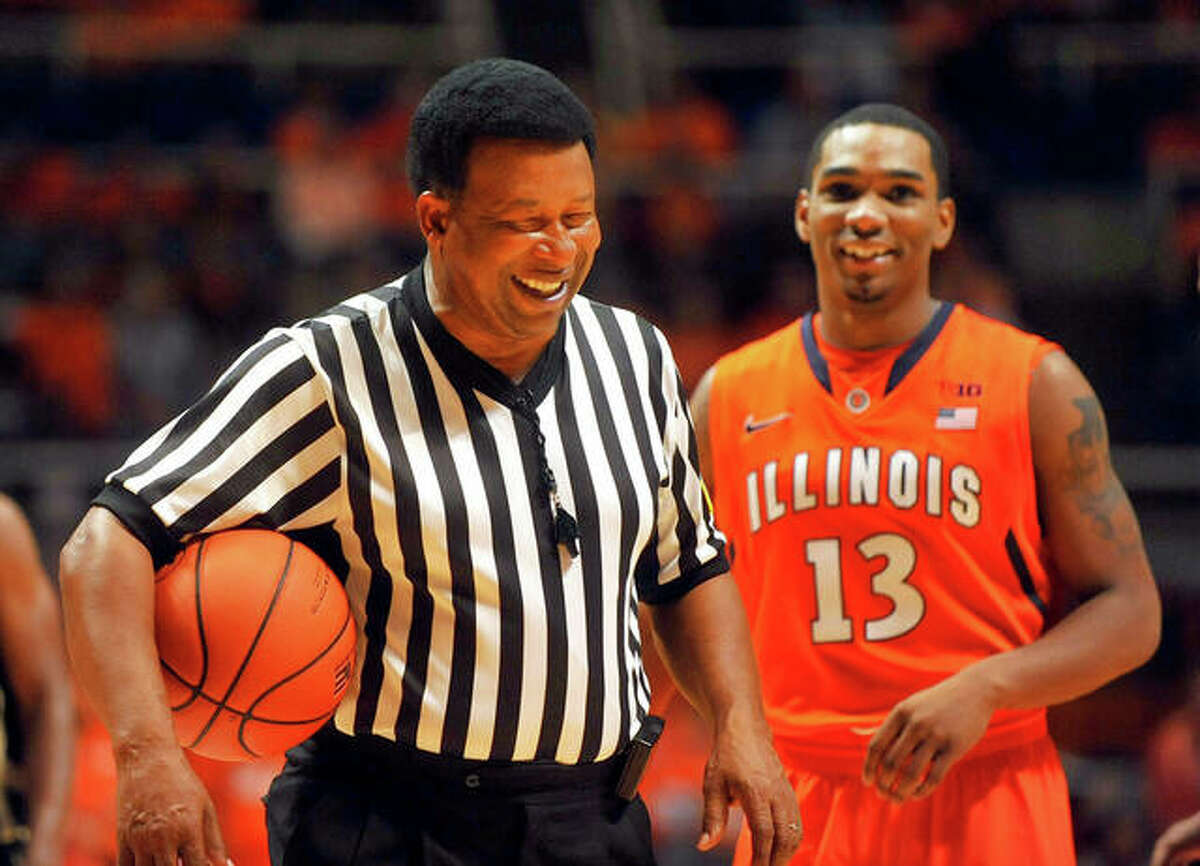 Official Ed Hightower laughs with Illinois guard Tracy Abrams during a timeout in the second half in an NCAA college basketball against Alabama State on Friday, Nov. 8, 2013, in Champaign, Ill.