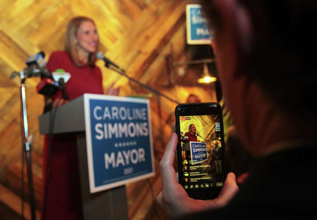 After unaffiliated mayoral candidate Bobby Valentine conceded, Democratic candidate Caroline Simmons speaks to her supporters at Third Place by Half Full Brewery on election night in Stamford, Conn., on Tuesday November 2, 2021. In back is Caroline's husband Art.