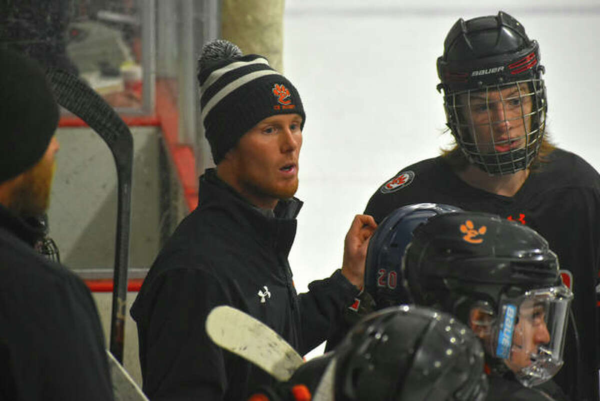 Edwardsville coach Jason Walker talks to his team during an intermission in Game 2 of the MVCHA championship series against Granite City last season.