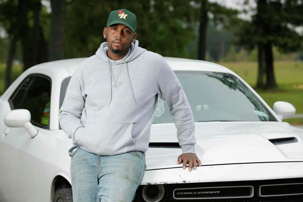 Darius Wilson, who was stopped for a tinted tail light by Cleveland police, with another car of his at Deussen Park Wednesday, Nov. 3, 2021 in Houston, TX.