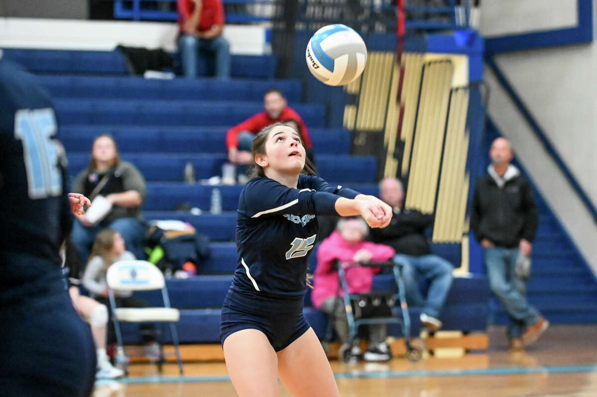 Meridian's Kendal Holzinger bumps the ball during their district semifinal volleyball game against St. Louis Wednesday, Nov. 3, 2021 at Meridian Early College High School. (Adam Ferman/for the Daily News)