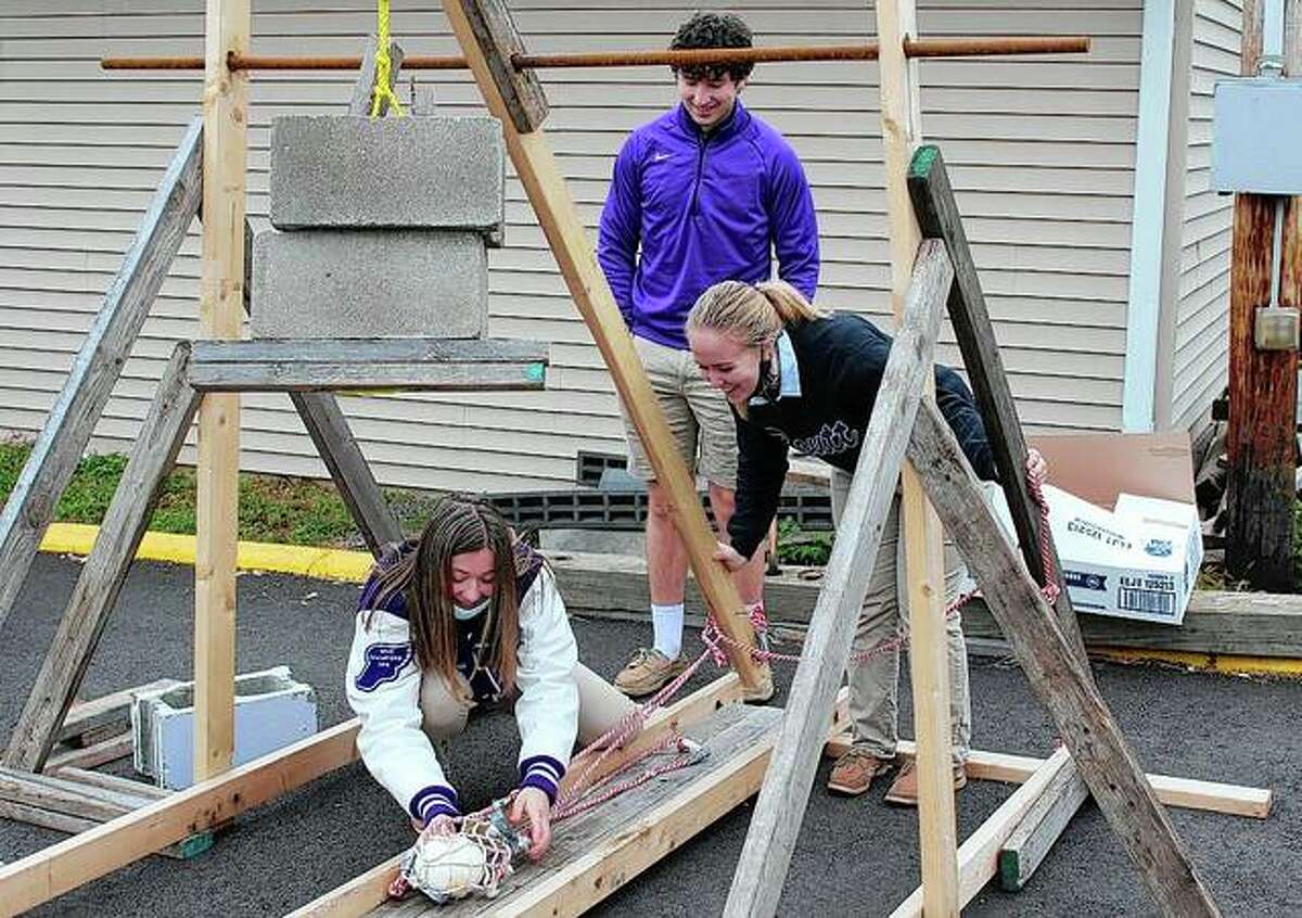 Routt Catholic High School physics students designed and built their own trebuchet — a type of catapult that uses a swinging arm to launch a projectile — and then competed to see which trebuchet could launch a 2-pound pumpkin the farthest. The team of Steven Schilsky, Audrey Huffman and Addie Dobson was declared the winner for the year and made the record books: It was the third-farthest throw in school history, at 179 feet, 6 inches. The record is 204 feet, 1 inch.