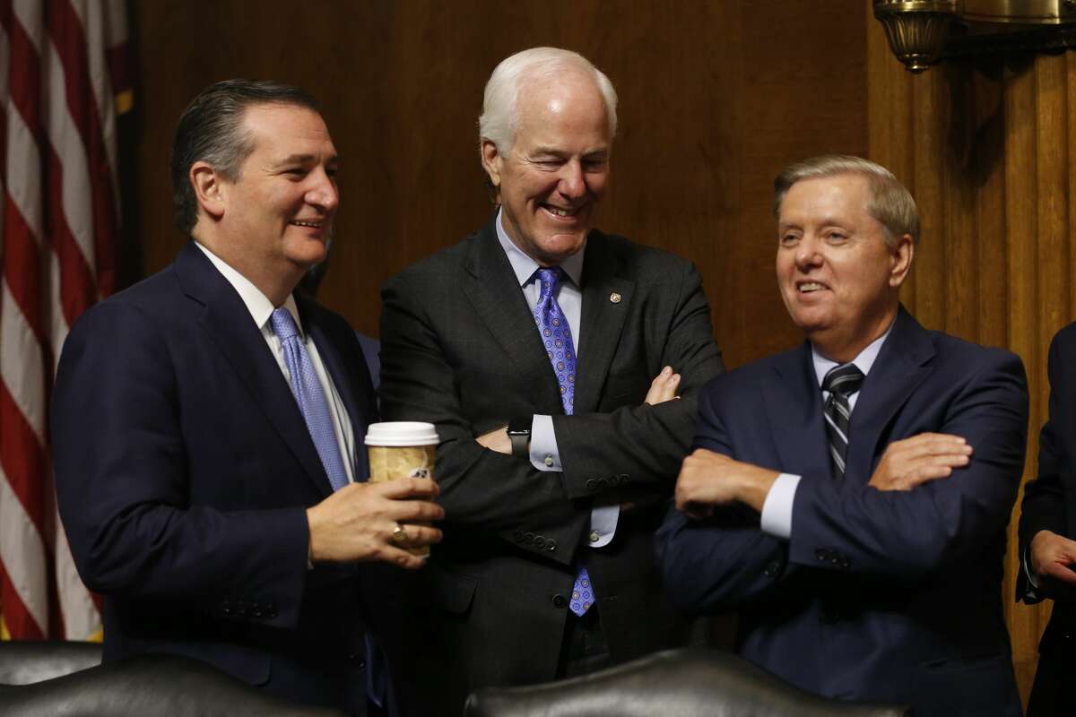 WASHINGTON, DC - SEPTEMBER 27: Republican Senators Ted Cruz (L), John Cornyn (C), and Lindsey Graham (R) chat during a break in the hearing on the nomination of Brett Kavanaugh to be an associate justice of the Supreme Court of the United States, on Capitol Hill September 27, 2018 in Washington, DC.