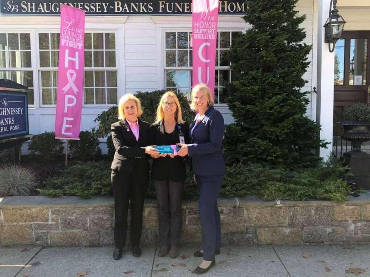 The Shaughnessey Banks Funeral Home supports the Norma F. Pfriem Breast Center at 267 Grant St in Bridgeport. The Shaughnessey Banks Funeral Home recently held a Beach Yoga event at Jennings Beach in Fairfield with Yoga Instructor Elaina Weiser. The employees of the Shaughnessey Banks Funeral Home were able to raise funds to donate to the Norma F. Pfriem Breast Center, and to support the mission of educating, and treating Breast Cancer patients in the community. The Shaughnessey Banks Funeral Home is located at 50 Reef Road in Fairfield. Pictured are: Pamala Shaughnessey Banks, who is the president, and the owner of the Shaughnessey Banks Funeral Home, Donna Twist, who is the executive director of the Norma F. Pfriem Breast Center, and Rebecca Lautenslager, who is the funeral director at the Shaughnessey Banks Funeral Home.