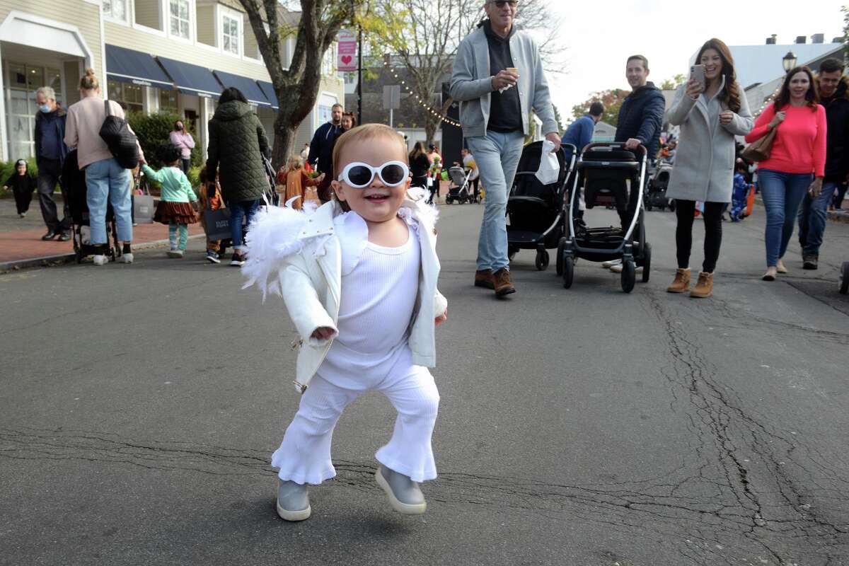 Dressed as A 1970s-era Elton John, Kennedy King-DeMarco enjoys the children’s Halloween parade.