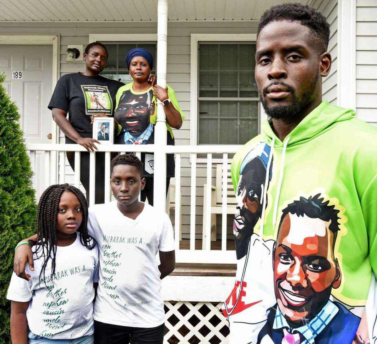 In this recent file photo, the  family of Mubarak Soulemane stands in front of their New Haven home. Mubarak Solulemane was fatally shot by a state trooper near I-95 off of exit 43. Standing on the porch, right rear is the mother of Mubarak Soulemane, Omo Mohammed. Mubarak's siblings from left rear to right: Mariyann Soulemane; Sirah Bandeh, 9; Ishamel Photo: Peter Hvizdak / Hearst Connecticut Media