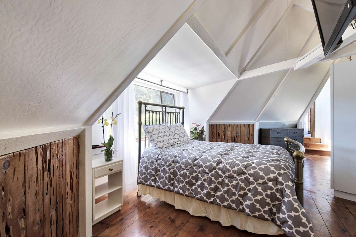 The home has multiple alcoves that can be used however the owner wants. Here a bedroom could easily be a home office as well.