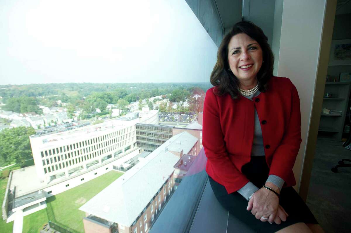 Stamford Hospital CEO and president Kathleen Silard looks out a window of Stamford Hospital overlooking the former hospital in Stamford, Conn. on Thursday, Oct. 4, 2018. Mayor-elect Caroline Simmons named Silard co-chair of her transition team.