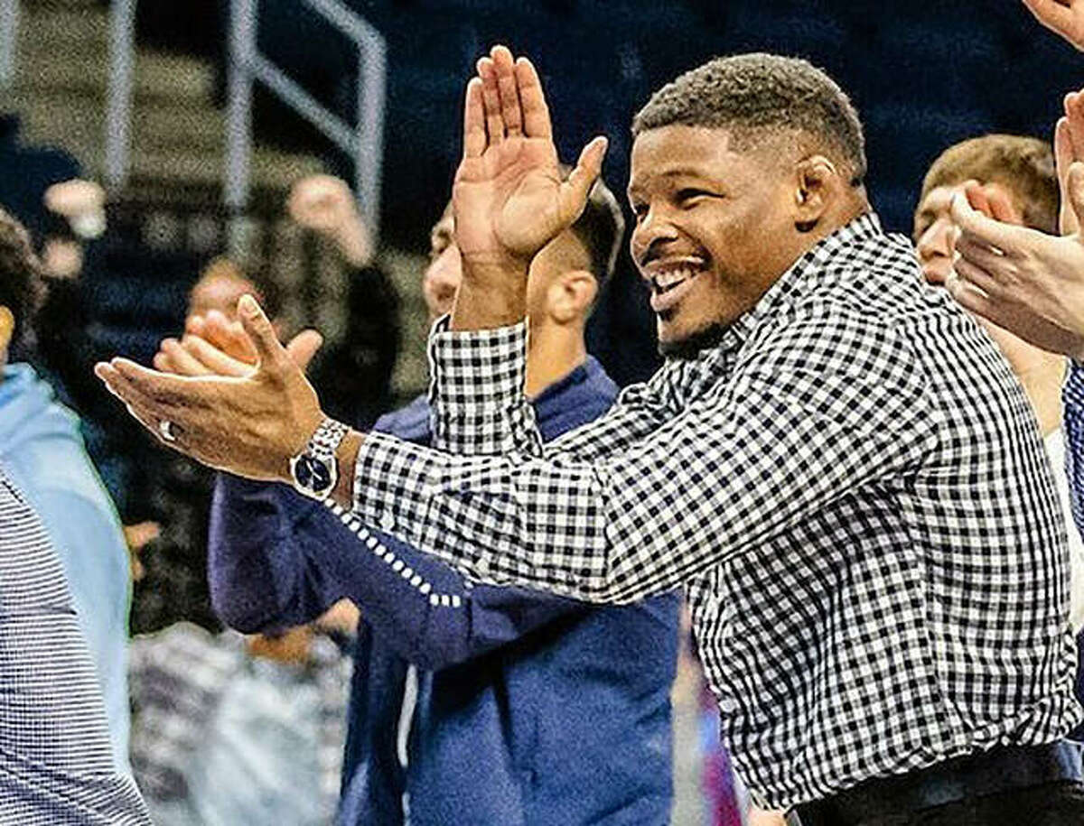 Daryl Thomas cheers on a Campbell University wrestler last season. An Edwardsville High grad and former University of Illinois wrestler, Thomas has been hired as associate head coach for the SIUE wrestling team.