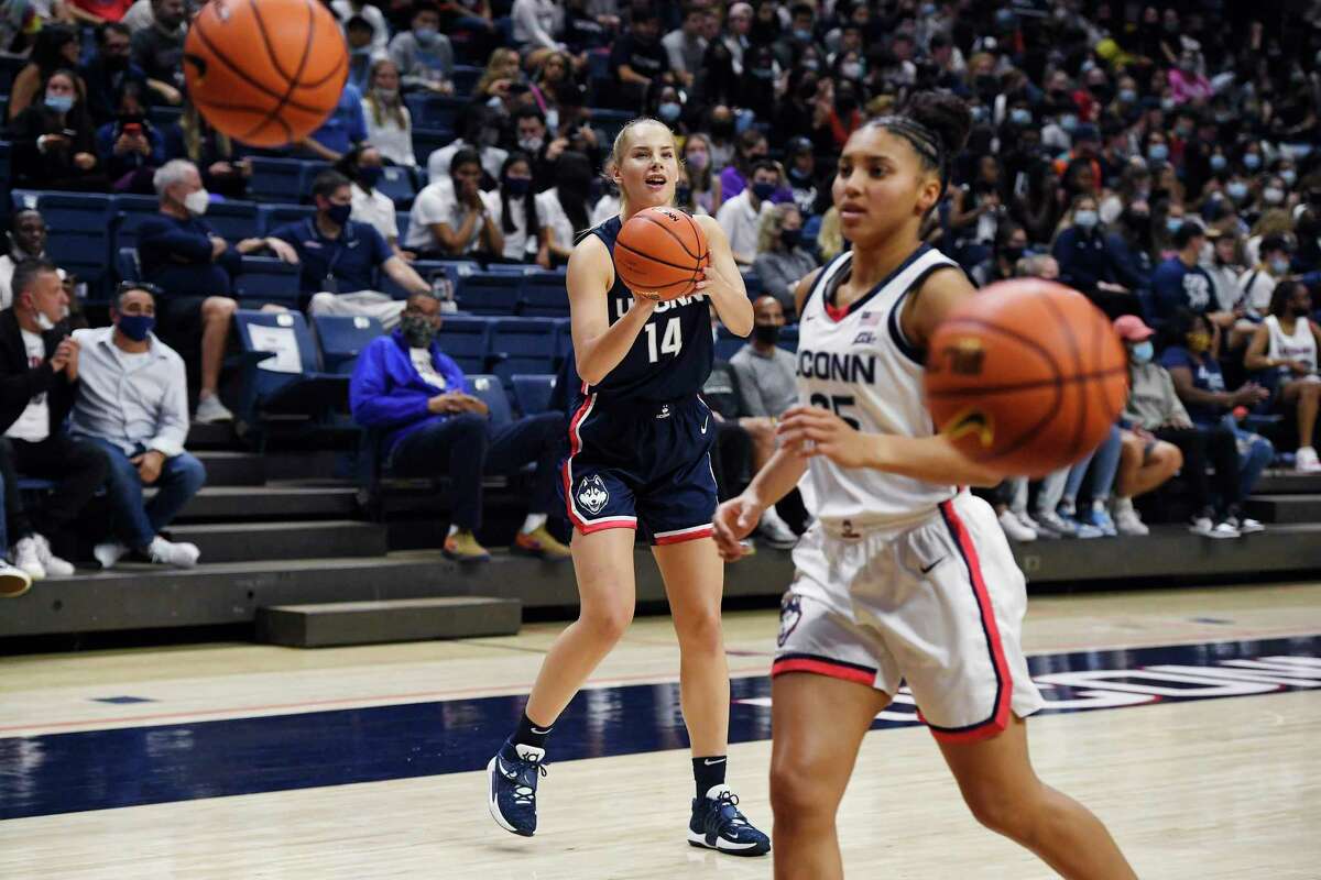 UConn’s Dorka Juhász shoots as Azzi Fudd chases down balls during First Night celebration on Oct. 15 in Storrs.