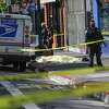 A body is covered after a shooting on Haight Street on Thursday, Nov. 4, 2021 in San Francisco, California.
