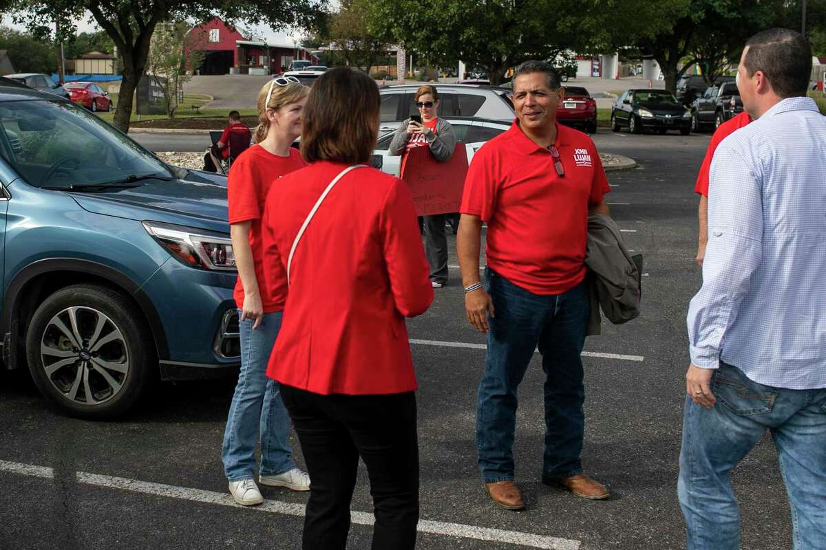 State Representative John Lujan talks with supporters outside of the Julia Yates Semmes Branch Library in San Antonio, Texas, on Nov. 2, 2021.