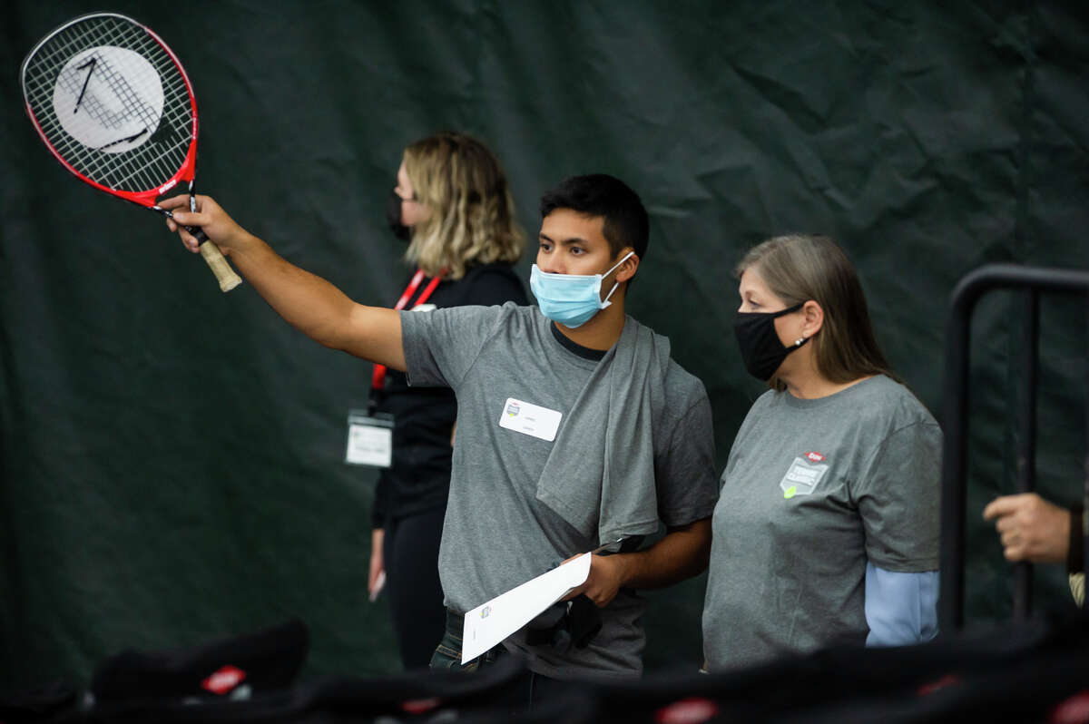 Tennis fans watch a feature match between Dalayna Hewitt of the USA and Misaki Doi of Japan during the Dow Tennis Classic Thursday, Nov. 4, 2021 at the Greater Midland Tennis Center. (Katy Kildee/Midland Daily News)