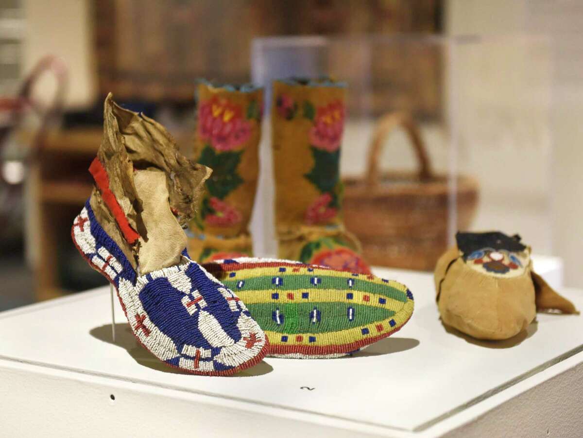 Lakota Sioux fully-beaded moccasins are displayed at the new exhibit "Resolute: Native Nations Art in the Bruce Collection" at the Bruce Museum in Greenwich, Conn. Wednesday, Nov. 3, 2021. The Bruce Museum is opening two new exhibitions on Nov. 7. "Resolute: Native Nations Art in the Bruce Collection" features significant objects that provide new information about Native Nations as historical and contemporary societies."The Fisher Dollhouse: A Venetian Palazzo in Miniature" features miniature renderings of 10 rooms inside a diorama inspired by Venice's glamorous Gritti Palace.