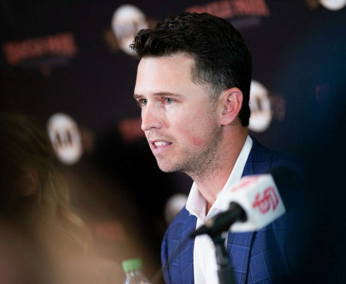 Seven-time All-Star catcher Buster Posey of the Giants announces his retirement from baseball during a news conference at Oracle Park in San Francisco.