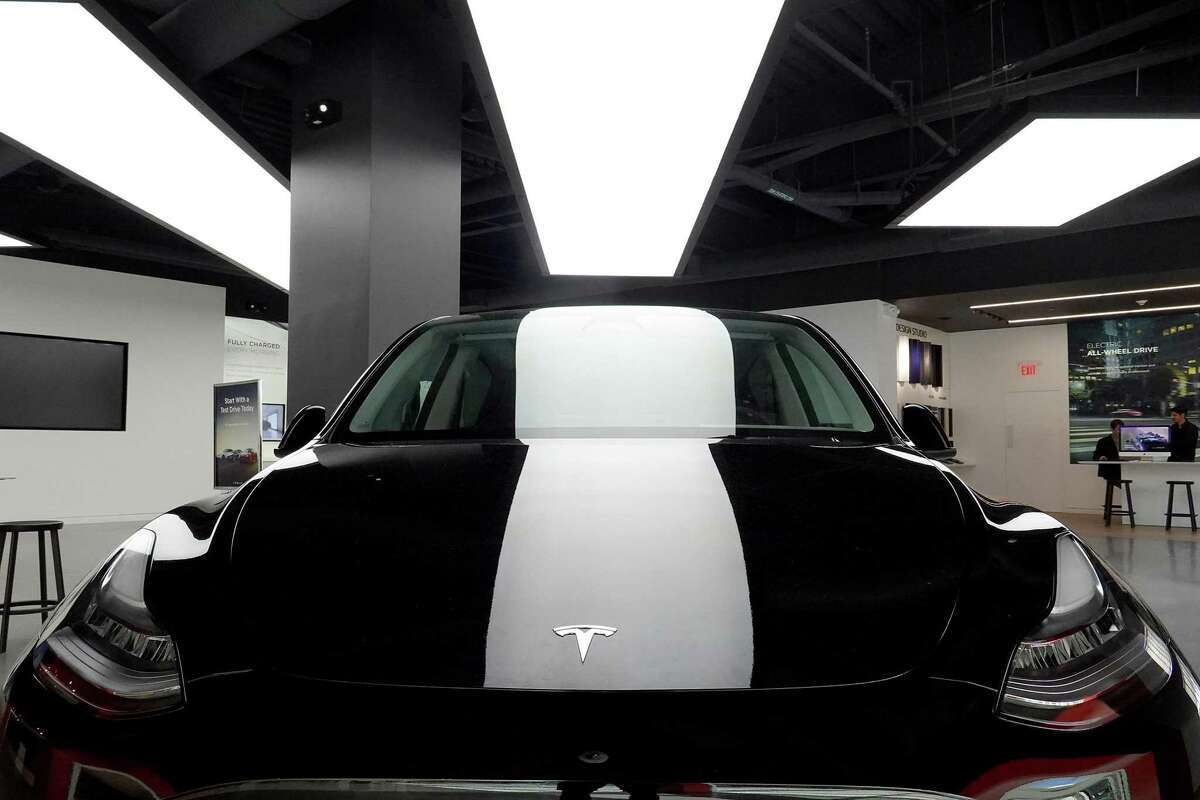 MIAMI, FLORIDA - OCTOBER 21: A Tesla Model Y electric vehicle is dispalyed on a showroom floor at the Miami Design District on October 21, 2021 in Miami, Florida. Tesla reported $1.6 billion in profits for the months of July, August, and September, a record for them. (Photo by Joe Raedle/Getty Images)