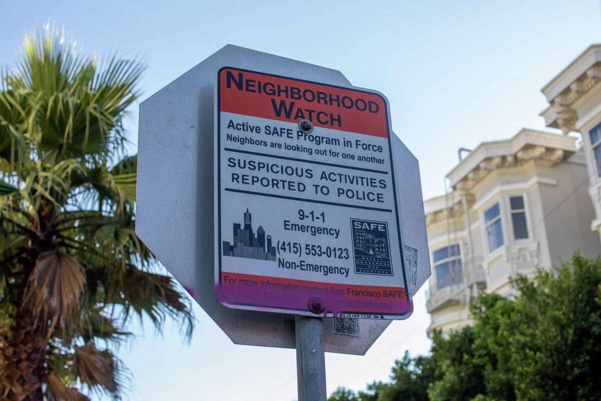 A sign on Hartford Street in the Castro encourages neighbors to be vigilant.