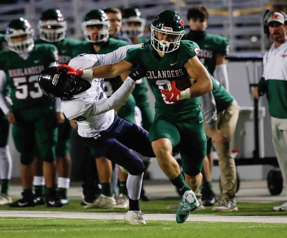 The Woodlands wide receiver Ben Ferguson (6) stiff-arms College Park defensive back Dylan Moore (29) on his way to a 41-yard gain during the second quarter of a high school football game at Woodforest Bank Stadium, Thursday, Nov. 4, 2021.