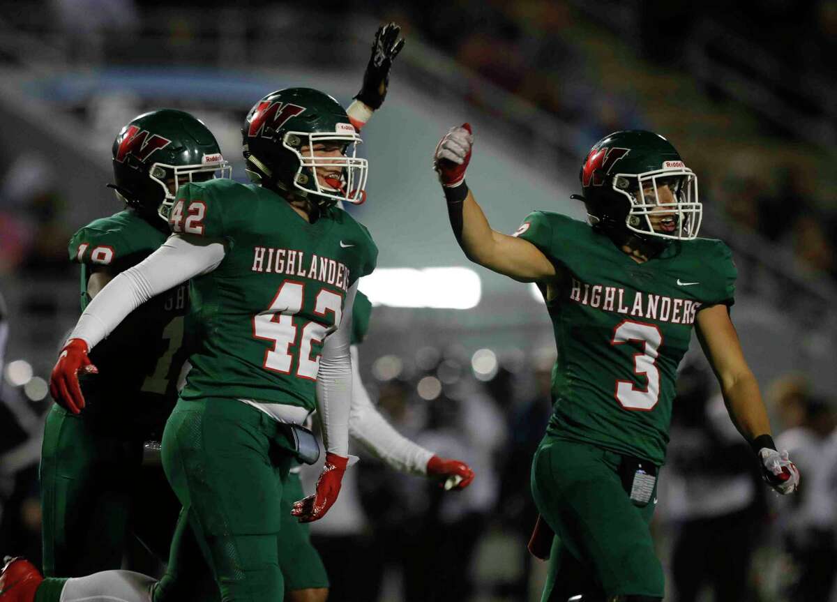 The Woodlands linebacker Tommy Kratt (42) celebrates after intercepting a pass from College Park quarterback Ty Buckmon during the fourth quarter of a high school football game at Woodforest Bank Stadium, Thursday, Nov. 4, 2021.