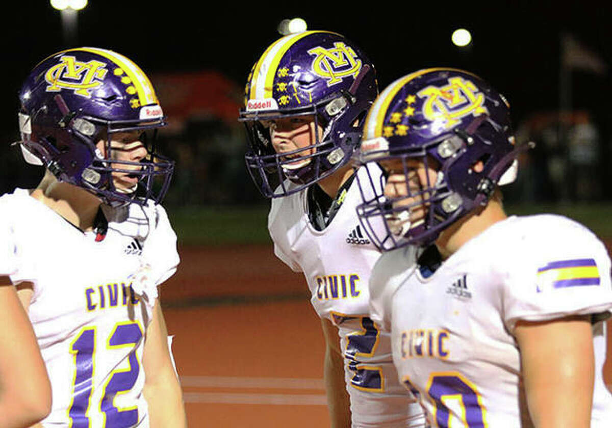 CM’s Luke Parmentier (12) and Nick Brousseau (right) congratulate Logan Turbyfill after Turbyfill’s TD catch in a game earlier this season at Waterloo. The Eagles finished their season 7-4 after a loss to Springfield Sacred Heart-Griffin Saturday in Bethalto.