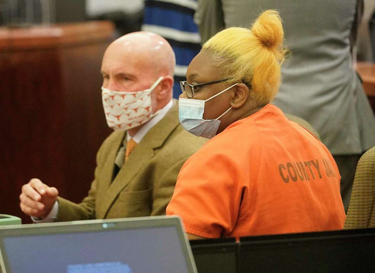 Neal Davis III, defense attorney, with his client Gloria Williams, the mother accused of abandoning children at apartment with brother’s skeletal remains, in the Harris County 178th Criminal Court of Judge Kelli Johnson during a bail review hearing Friday, Nov. 5, 2021 in Houston.