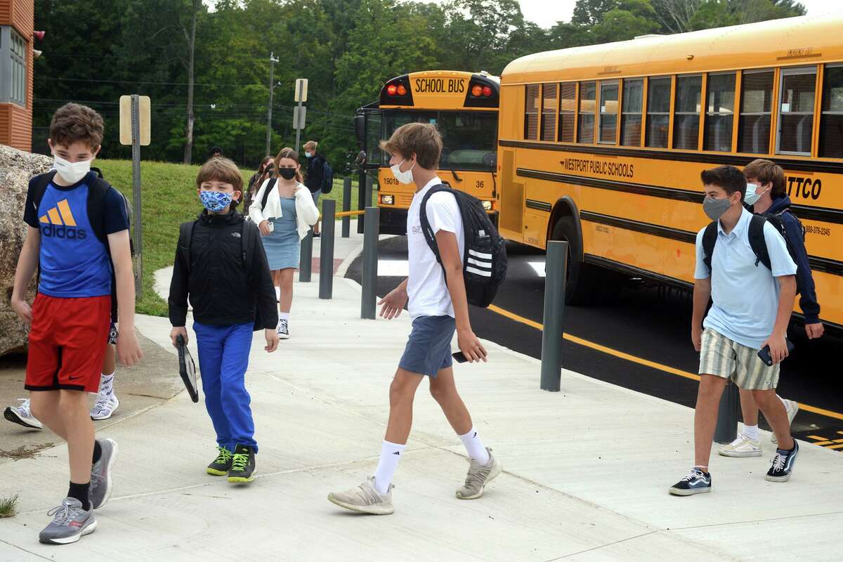 Students arrive for the first day of classes at Coleytown Middle School, in Westport, in August.