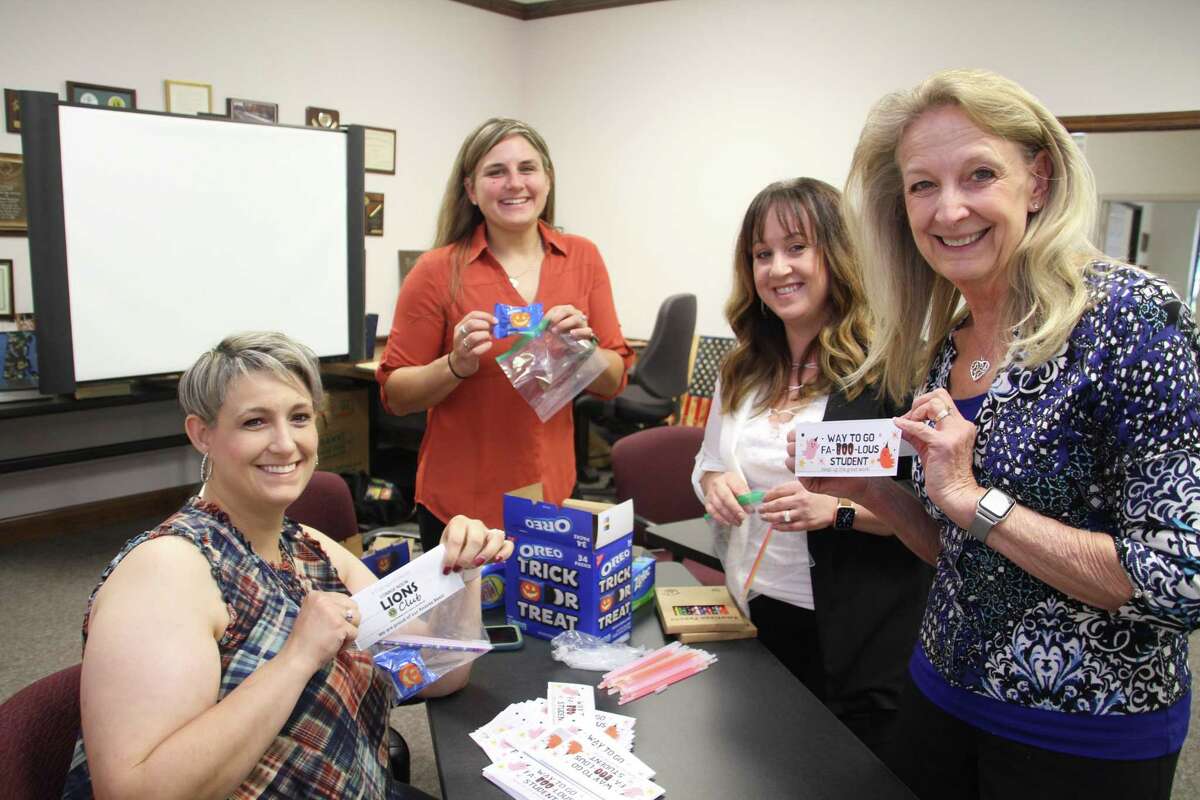 Stuffing for Students - Conroe Noon Lions Club members prepare goodie bags for students who earned excellent grades and attendance at the club’s adopted school - Reaves Elementary School. Pictured left to right are Marcey Phillips, Amanda Anders, Elizabeth Anderson, Helen Thornton.