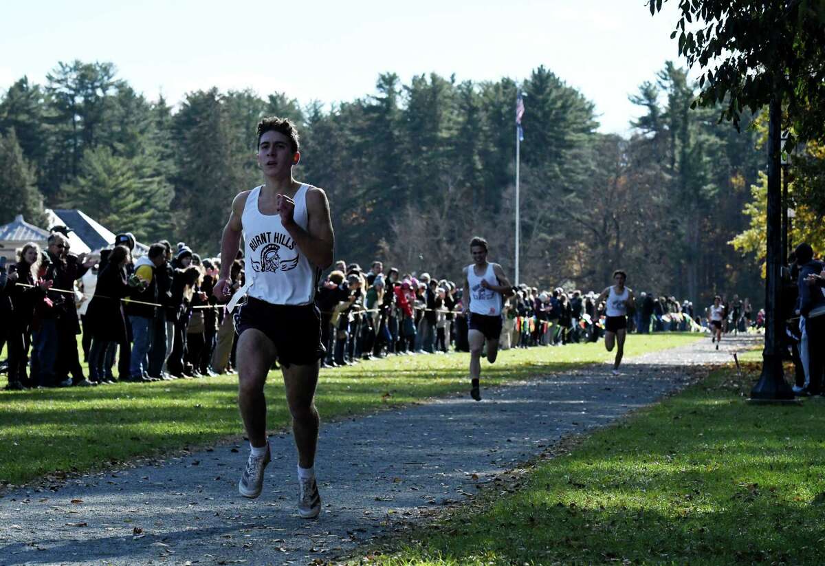 Matthew Rounds brings in the Burnt Hills-Ballston Lake team behind teammate Peter Fulgieri to claim first place in the Class B boys Section II Cross Country Championships on Friday, Nov. 5, 2021, at Saratoga Spa State Park in Saratoga Springs, N.Y. Rounds finished 5th.