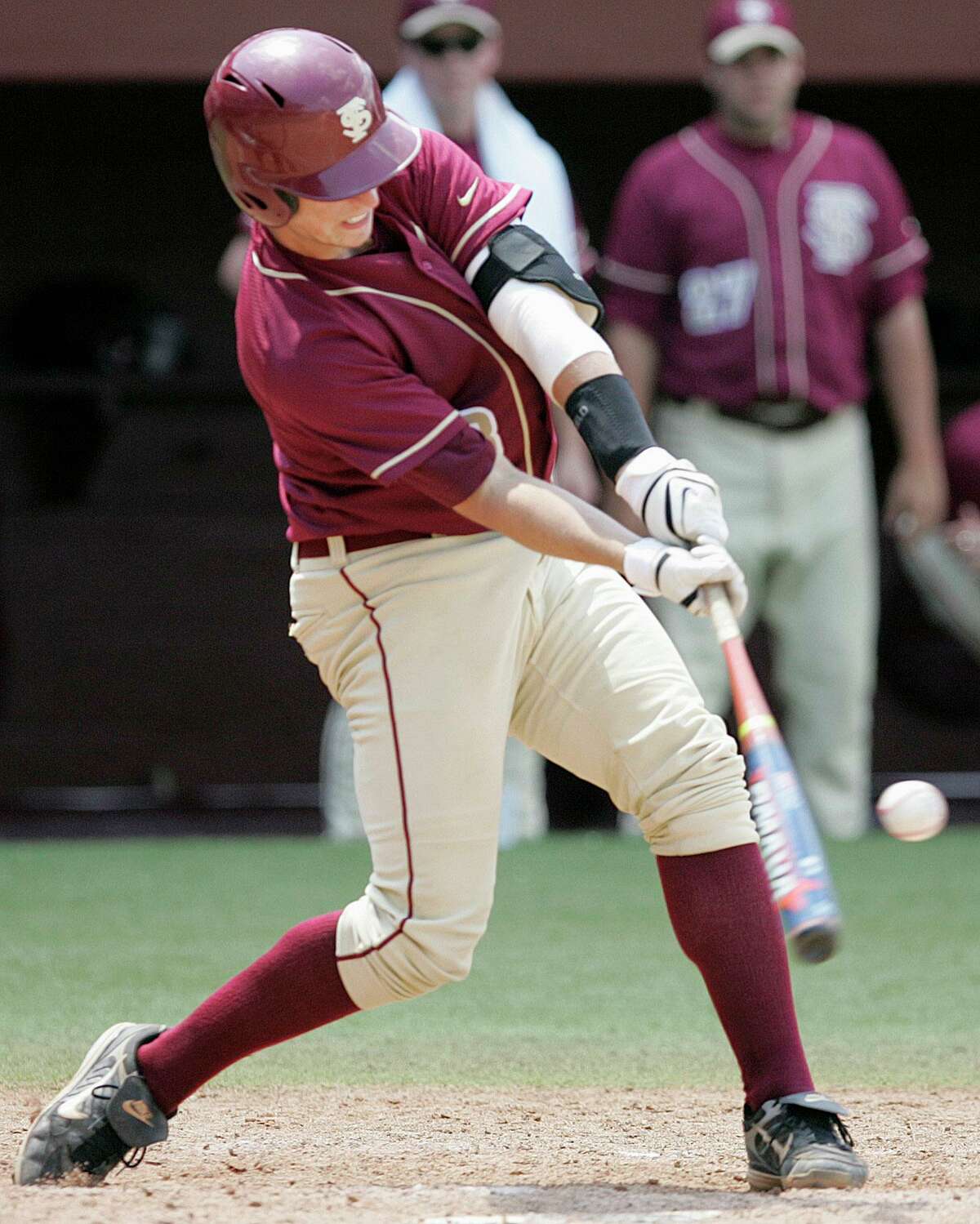 Florida State's Buster Posey hits a two run home run against Wichita St in the seventh inning of the NCAA Tallahassee Super Regional baseball game which Florida St won 11-4 on Sunday, June 8, 2008 in Tallahassee, Fla. (AP Photo/Steve Cannon)
