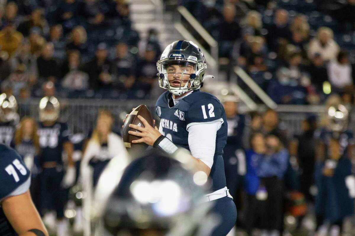 Nevada quarterback Carson Strong (12) looks to throw against UNLV in the first half of an NCAA college football game in Reno, Nev., Friday, Oct. 29, 2021. (AP Photo/Tom R. Smedes)