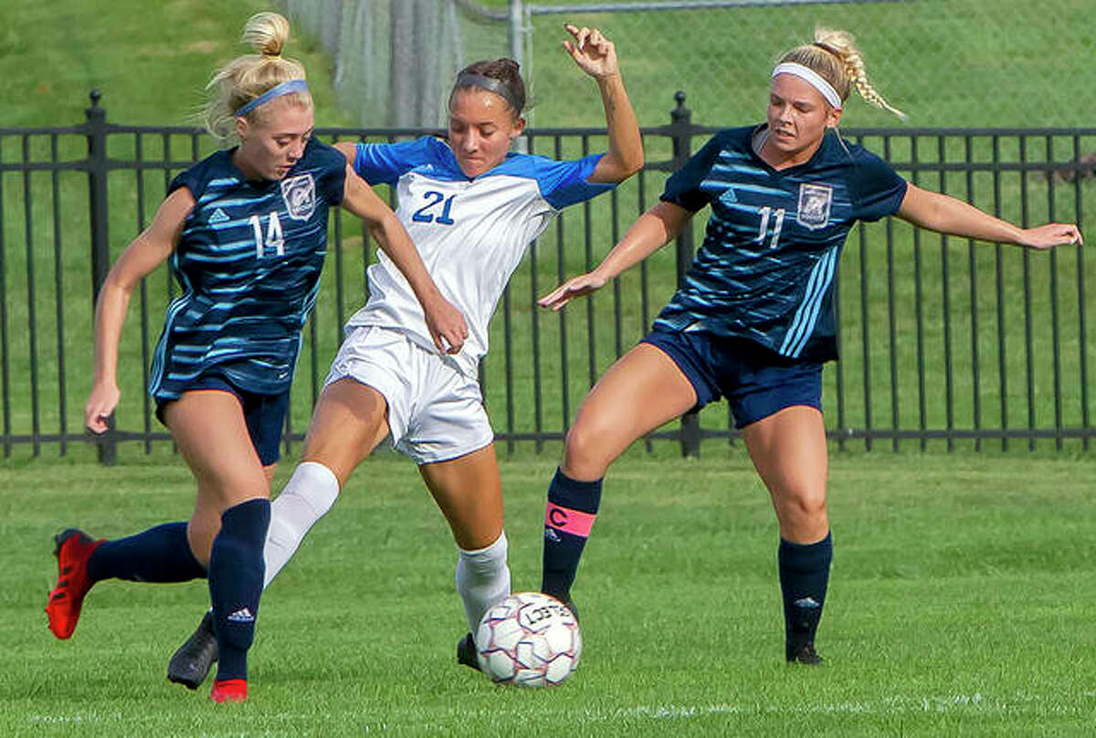 LCCC’s Skylar Nickel, 21, battles for the ball against a pair of St. Louis Community College players earlier this season. Nickel and her LCCC teammates will play host to No. 4 Iowa Western at noon Saturday in the Central District Final at Tim Rooney Stadium in Godfrey.